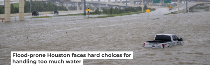 A roadside assistance vehicle is swamped by floodwaters on a Houston highway in 2024. Brandon Bell/Getty Images